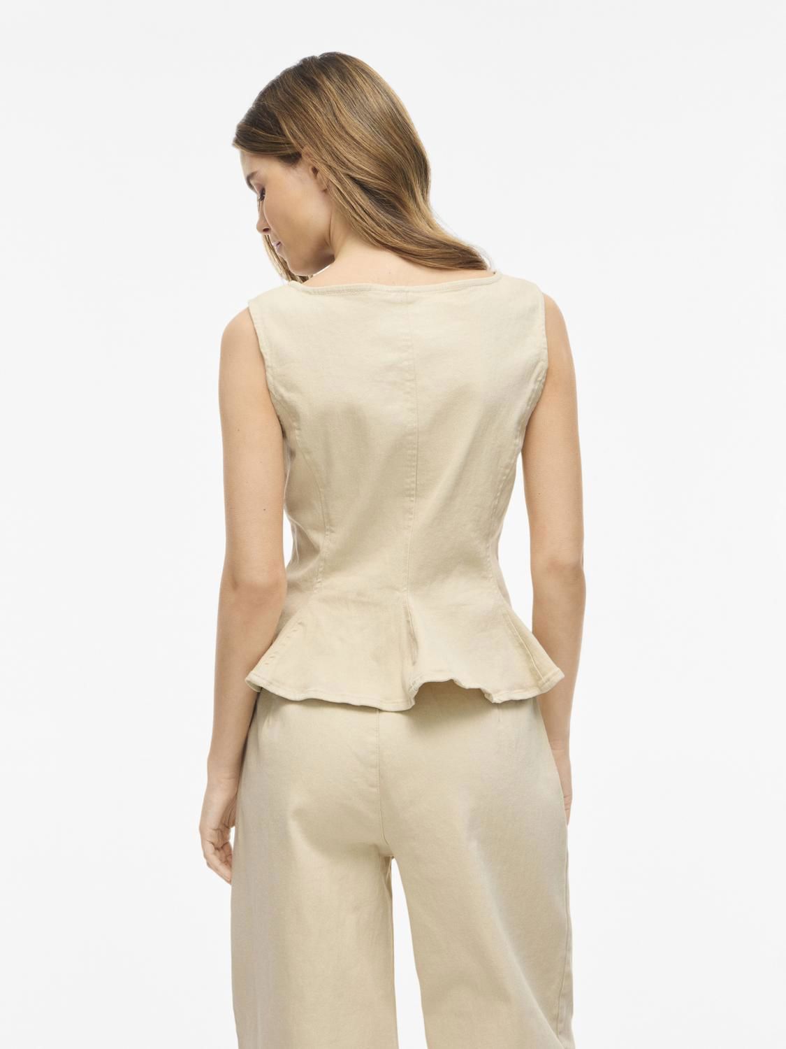 Vichia Peplum Top